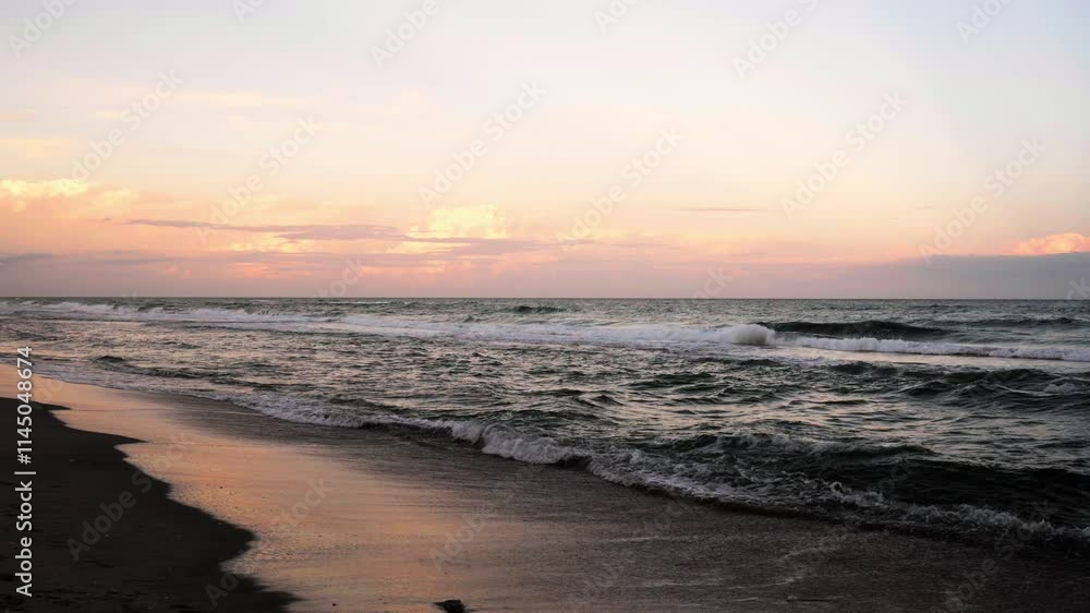 sunset over ocean with waves crashing on beach sunset over ocean with waves crashing on beach