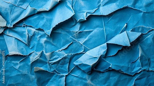 Wallpaper Mural Close-up of crumpled blue paper texture with deep folds and shadows, creating an abstract artistic background. Torontodigital.ca
