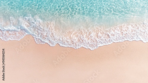 Fototapeta Naklejka Na Ścianę i Meble -  Abstract sand beach from above with light blue water wave. Summer vacation background banner with copy space.