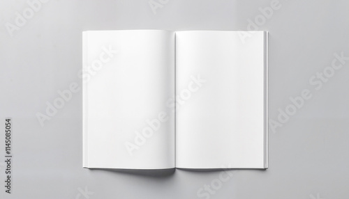 Empty open book on a gray background for mockup and design purposes