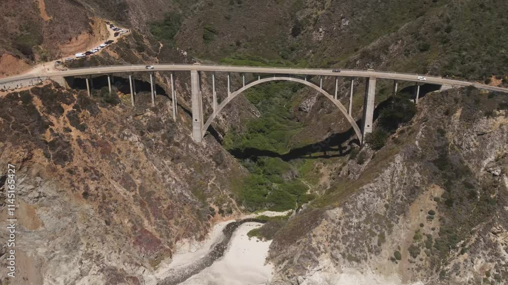 Aerial shot of the Bixby Creek Bridge and rugged coastline along the Pacific Coast Highway in Central California Aerial shot of the Bixby Creek Bridge and rugged coastline along the Pacific Coast Highway in Central California