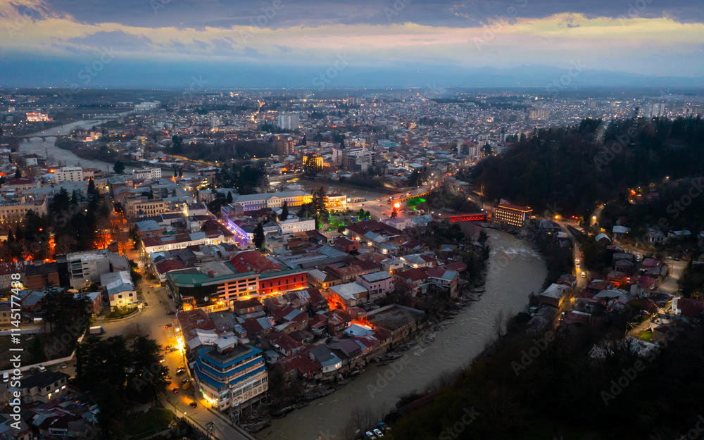 Fototapeta premium Evening top view of the historic city of Kutaisi, located on the two banks of the Rioni River, Georgia