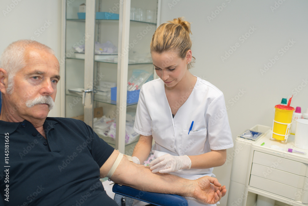 Fototapeta premium nurse is taking blood for test at the doctor office