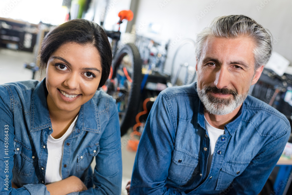 woman and man working in a bike store woman and man working in a bike store