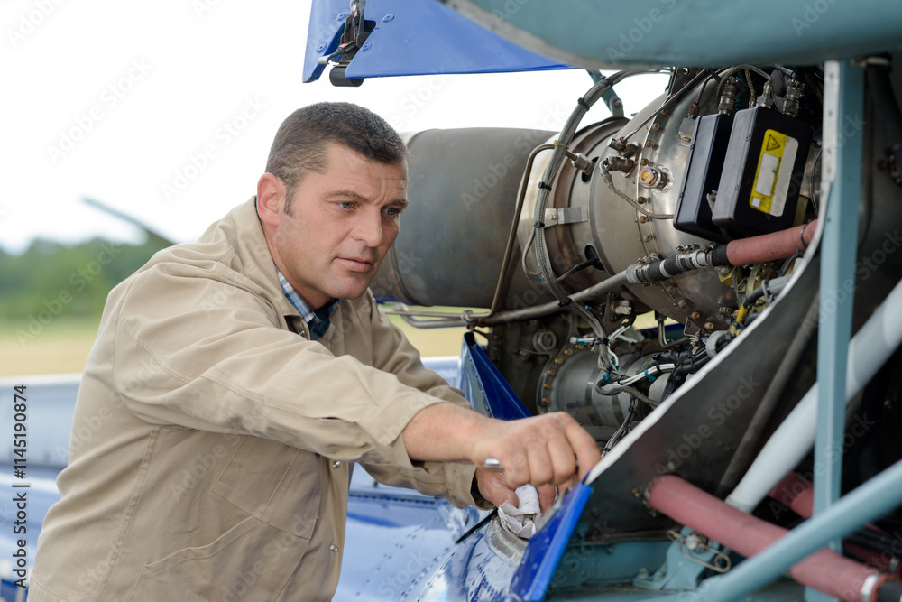 portrait of a mechanic during inspection portrait of a mechanic during inspection