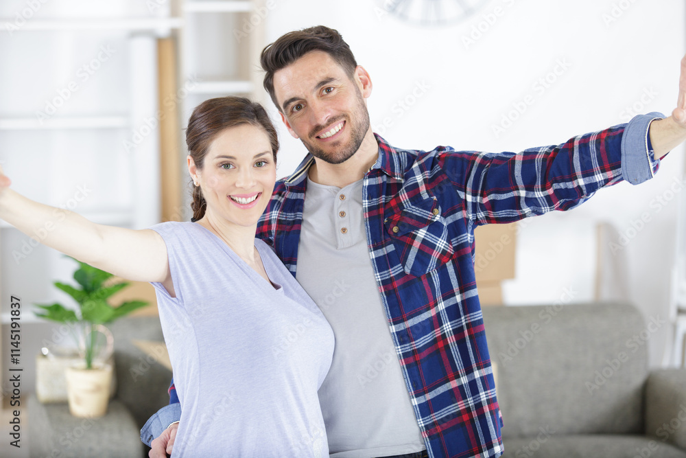 happy pregnant couple with belongings at new home happy pregnant couple with belongings at new home