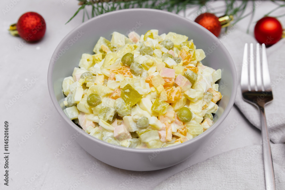Olivier salad,Christmas food.salad with chicken and vegetables,pea.Traditional ukrainian slavic appetizer recipe for celebrating new year's eve. Festive table setting with decoration. Olivier salad,Christmas food.salad with chicken and vegetables,pea.Traditional ukrainian slavic appetizer recipe for celebrating new year's eve. Festive table setting with decoration.