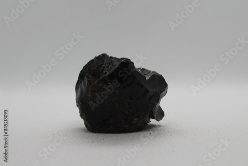Fotografie Black slag stone isolated on a white background