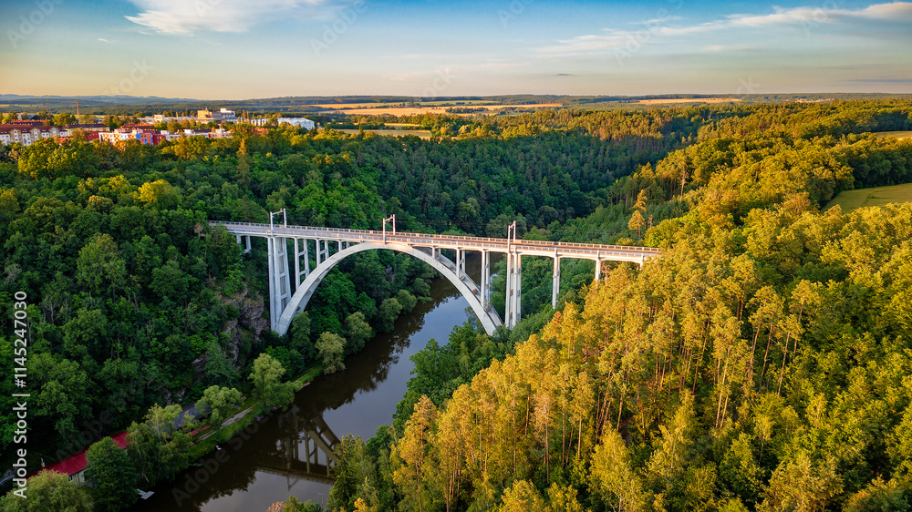 The Bechyně bridge called the Rainbow. Drone view from the town of Bechyně of the dominant structure of the bridge and the river Lužnice