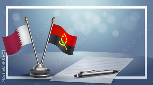 Qatar and Angola National flags on small table with bokeh background, cooperative relationship.....