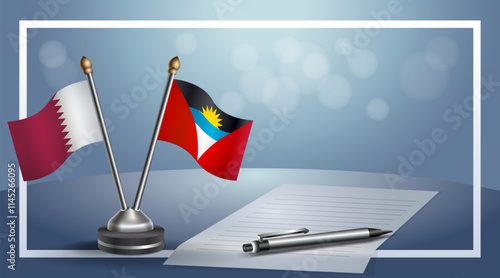 Qatar and Antigua and Barbuda National flags on small table with bokeh background, cooperative relationship.....