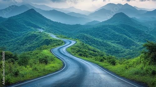 Winding Road Through Lush Green Mountains