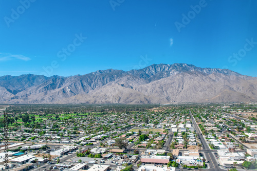 Aerial View of Palm Springs, CA Skyline and Residential Neighborhood Community With Golf Courses