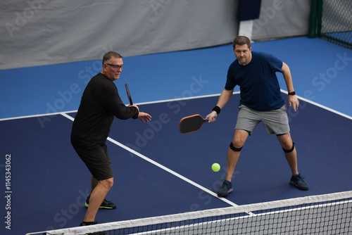 Pickleball doubles played indoors