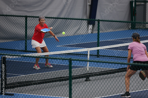 Senior woman playing pickleball