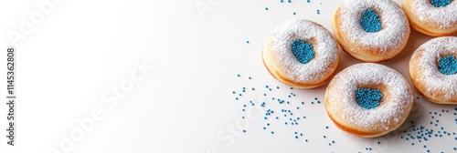 A delightful arrangement of sufganiyot filled with sweet goodness dusted with powdered sugar and blue sprinkles perfect for celebrating Hanukkah in style and enjoying festive treats photo