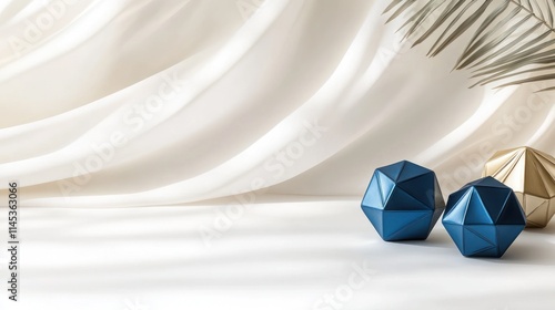 Three dreidels in striking blue and gold rest elegantly on a soft white surface complemented by gentle shadows and ample space perfect for Hanukkah festivities photo