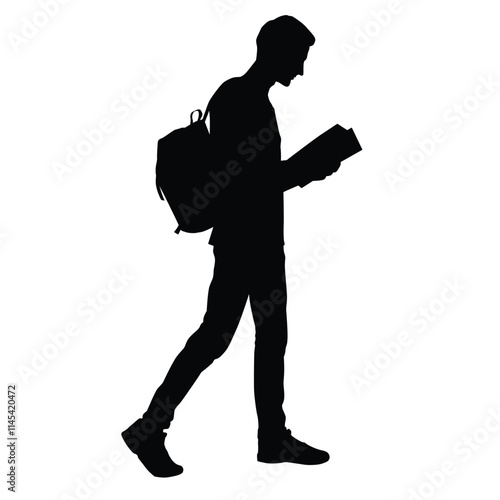Silhouette of a student walking while reading a book