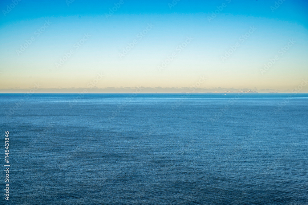 View of ocean water surface with clear sky background View of ocean water surface with clear sky background