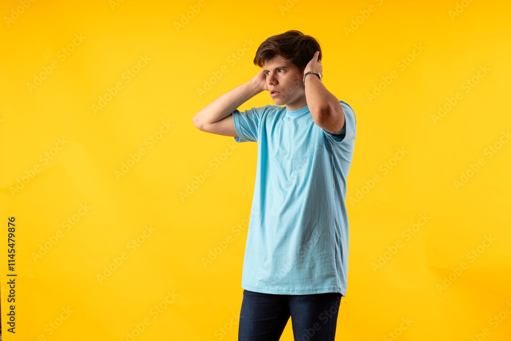 Young person expressing various emotions and body pains, pointing, using a cellphone, with colored backgrounds and wearing shirts of different colors Young person expressing various emotions and body pains, pointing, using a cellphone, with colored backgrounds and wearing shirts of different colors