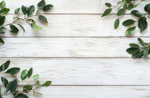 A light wooden background adorned with green leaves for a natural, fresh aesthetic.