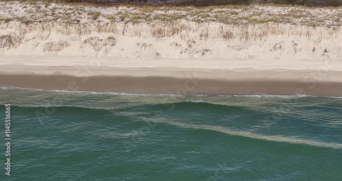 Southampton, NY, USA - 11-20-2024:  Late morning aerial, drone, video of Panquogue Beach on a sunny fall day.  30 FPS