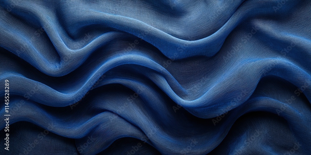 Fototapeta premium Dynamic abstract fabric with soft flowing textures in rich blue hues, evoking elegance and modern artistic creativity