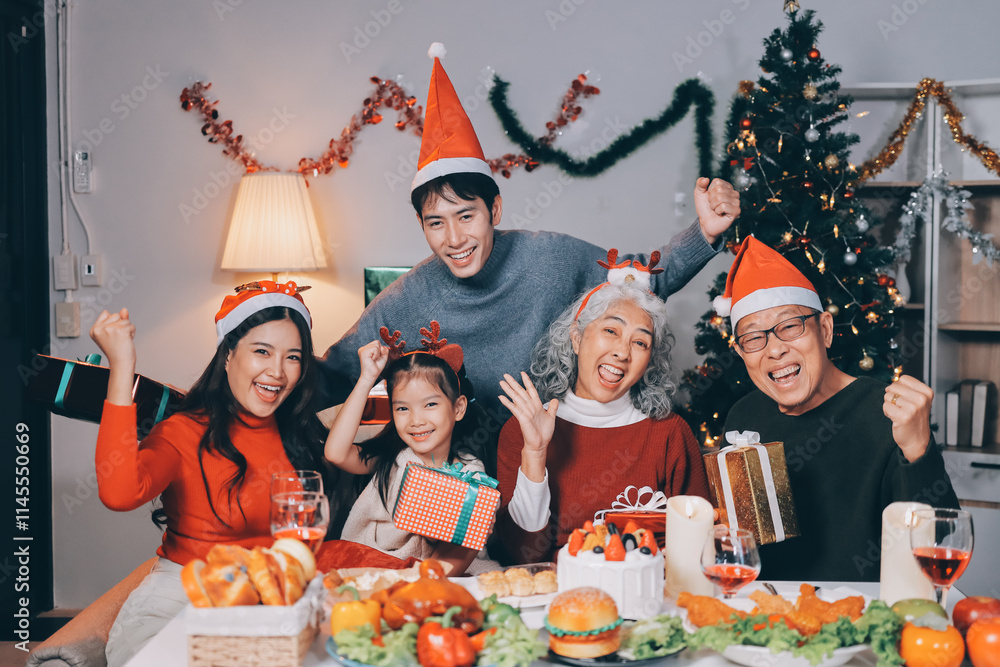 Happy family with gifts celebrating Christmas together Happy family with gifts celebrating Christmas together