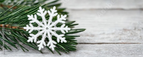 Macro natural concept. A delicate snowflake resting on a pine branch, showcasing nature's winter beauty.