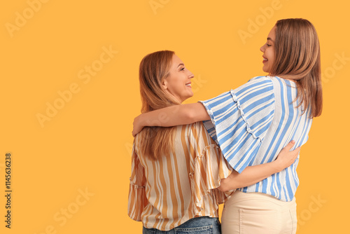 Two happy women embracing e...