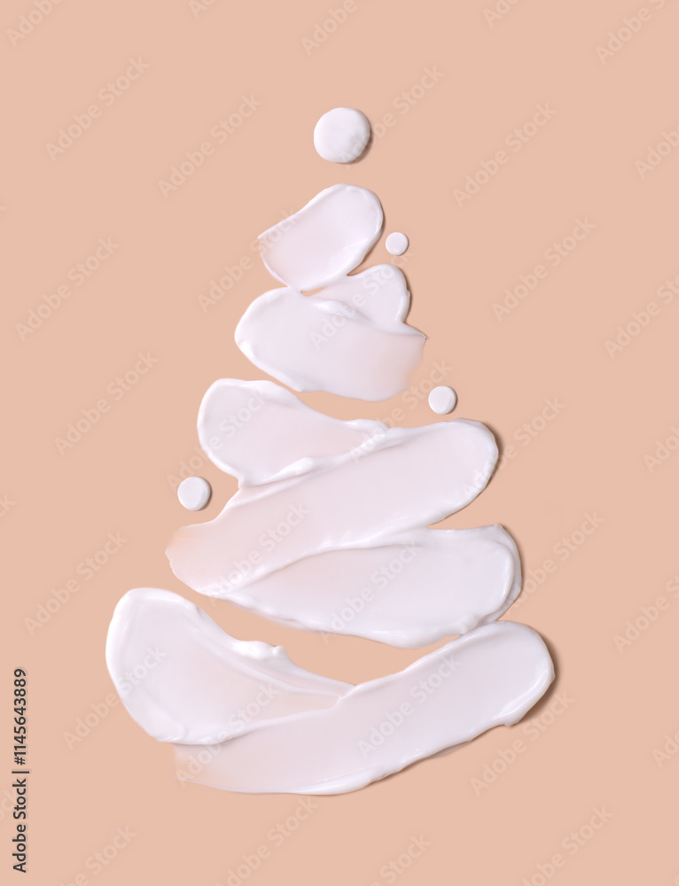 Christmas tree concept in the form of cosmetic strokes on a beige background. Skin hydration in winter. Winter concept. Christmas tree concept in the form of cosmetic strokes on a beige background. Skin hydration in winter. Winter concept.