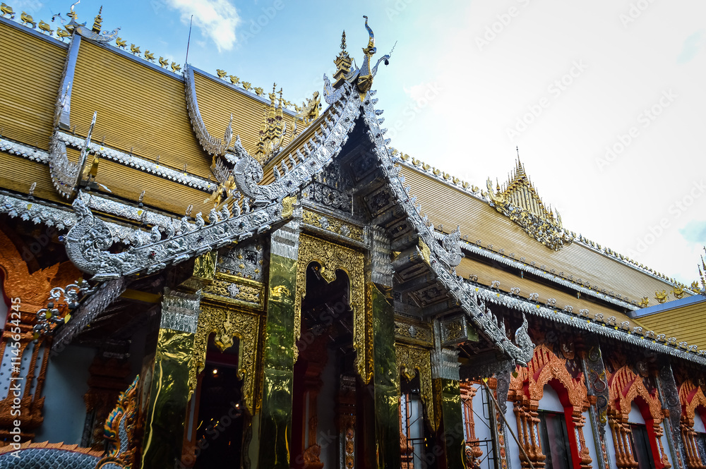 Fototapeta premium Buddha statue and Church, Lanna Architecture at Watsridonmoon, smbols of Buddhism, South East Asia at Chiangmai Northern Thailand