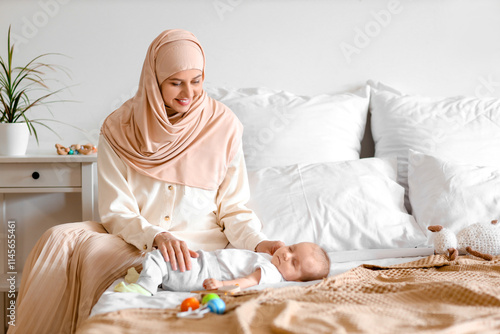 Happy muslim mother wearing...