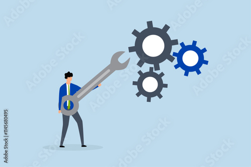 Adjustment and optimization for business improvement, entrepreneur grasping wrench to modify gear cogwheels configuration.