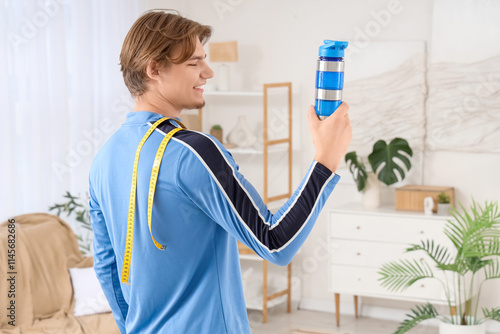 Sporty young man with tape ...