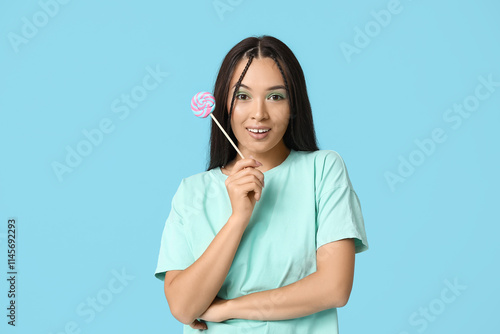 Young woman holding colorfu...