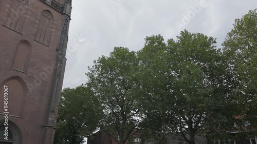 Onze Lieve Vrouwetoren in Amersfoort, Netherlands, historic Gothic church tower under cloudy skies photo