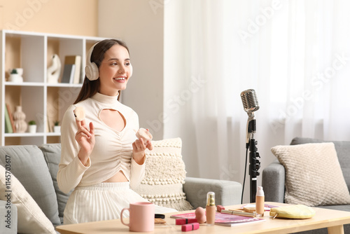 Young woman in headphones w...