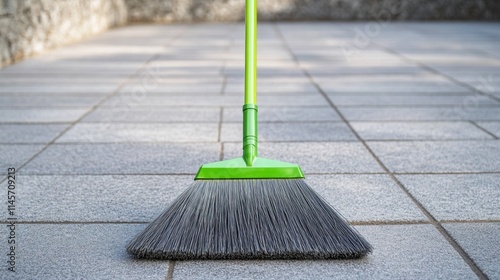 Wallpaper Mural Bright Green Broom on Gray Tiled Surface for Cleaning Purposes Torontodigital.ca