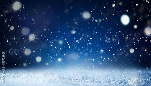 雪がキラキラと舞っているイメージ、青色の背景