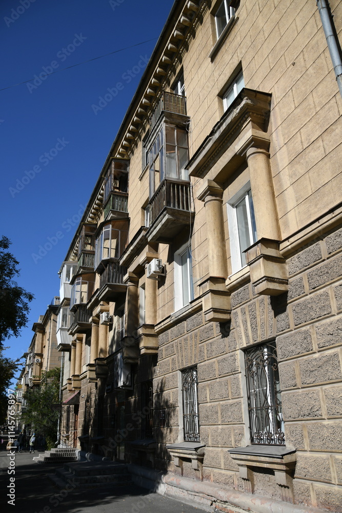 Architecture of old Soviet Union houses in Stalin's Empire style. Exterior of the facade of a vintage residential building in Russia Architecture of old Soviet Union houses in Stalin's Empire style. Exterior of the facade of a vintage residential building in Russia