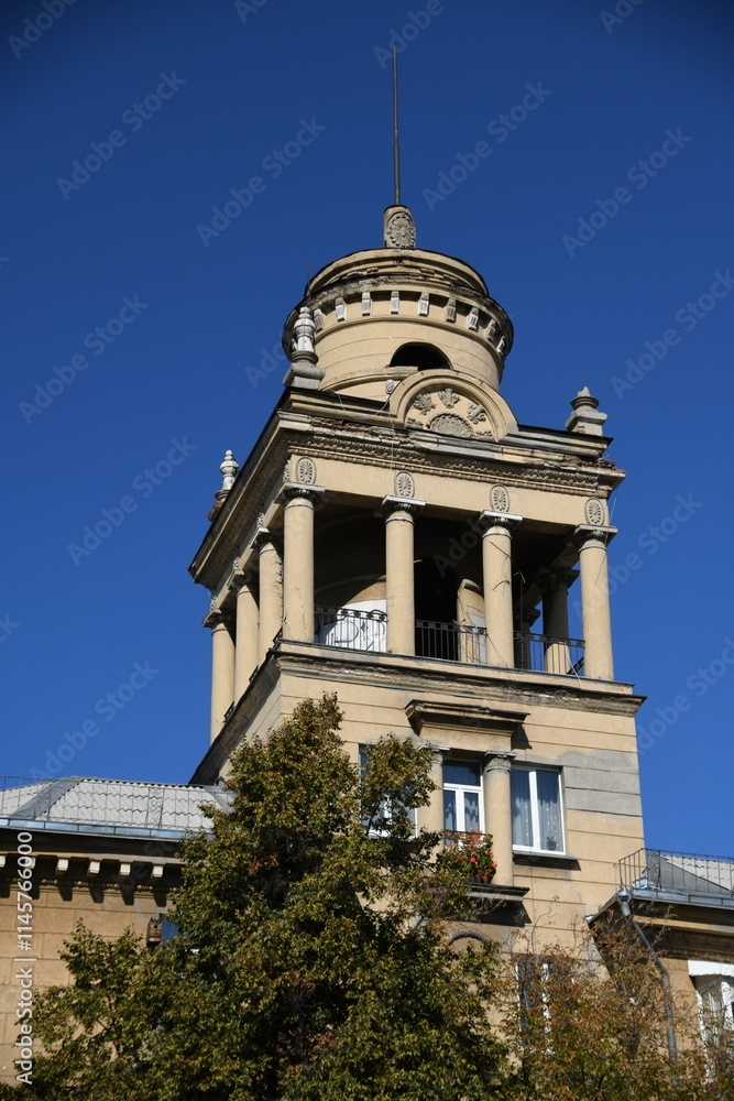 Fototapeta premium Architecture of old Soviet Union houses in Stalin's Empire style. Exterior of the facade of a vintage residential building in Russia