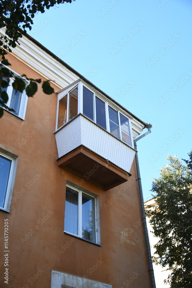 Architecture of old Soviet Union houses in Stalin's Empire style. Exterior of the facade of a vintage residential building in Russia Architecture of old Soviet Union houses in Stalin's Empire style. Exterior of the facade of a vintage residential building in Russia