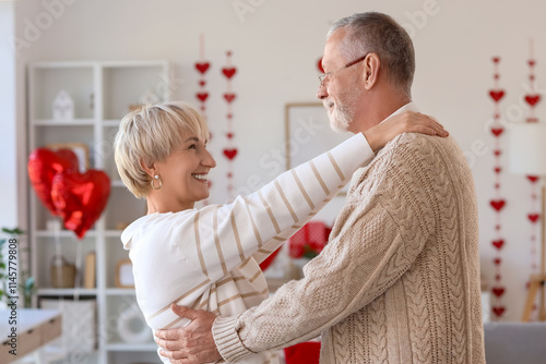 Happy mature couple hugging...