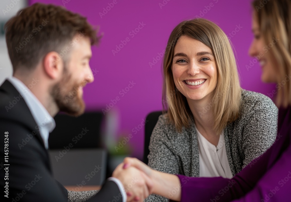 Professional Handshake Between Colleagues in Modern Office Setting Professional Handshake Between Colleagues in Modern Office Setting