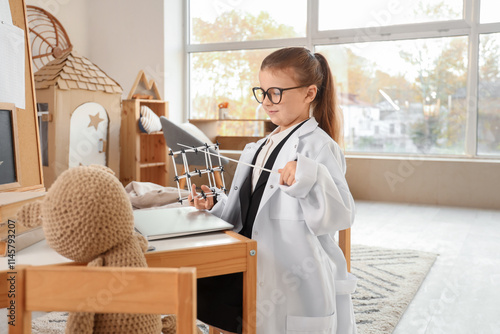 Cute little chemist with po...