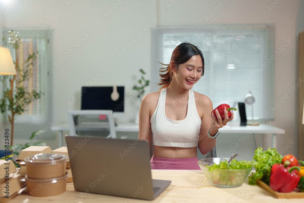 Young Asian woman live chatting, video calling on laptop computer, how to lose weight with diet. Introducing useful fruits and vegetables Lifestyle Influencer Healthy concept, lifestyle. Young Asian woman live chatting, video calling on laptop computer, how to lose weight with diet. Introducing useful fruits and vegetables Lifestyle Influencer Healthy concept, lifestyle.