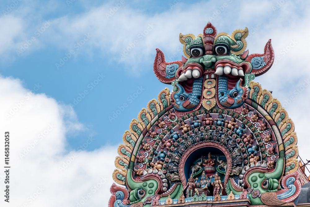 Naklejka premium Detail of ornate carvings on the roof of the gopuram tower of the ancient Sriranganathaswamy temple in Srirangam