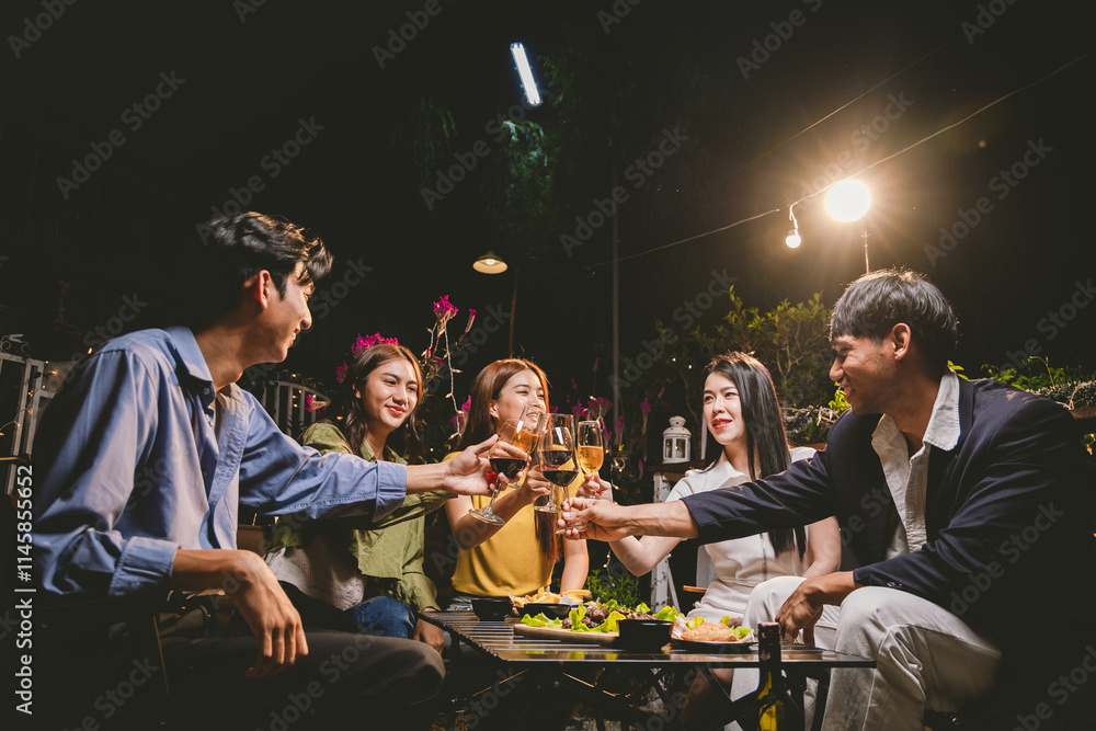 A joyful group of friends and family gathered around a dinner table, raising wine glasses in a celebratory toast. Smiling and laughing, they enjoy food, drinks, and togetherness in a festive atmospher A joyful group of friends and family gathered around a dinner table, raising wine glasses in a celebratory toast. Smiling and laughing, they enjoy food, drinks, and togetherness in a festive atmospher