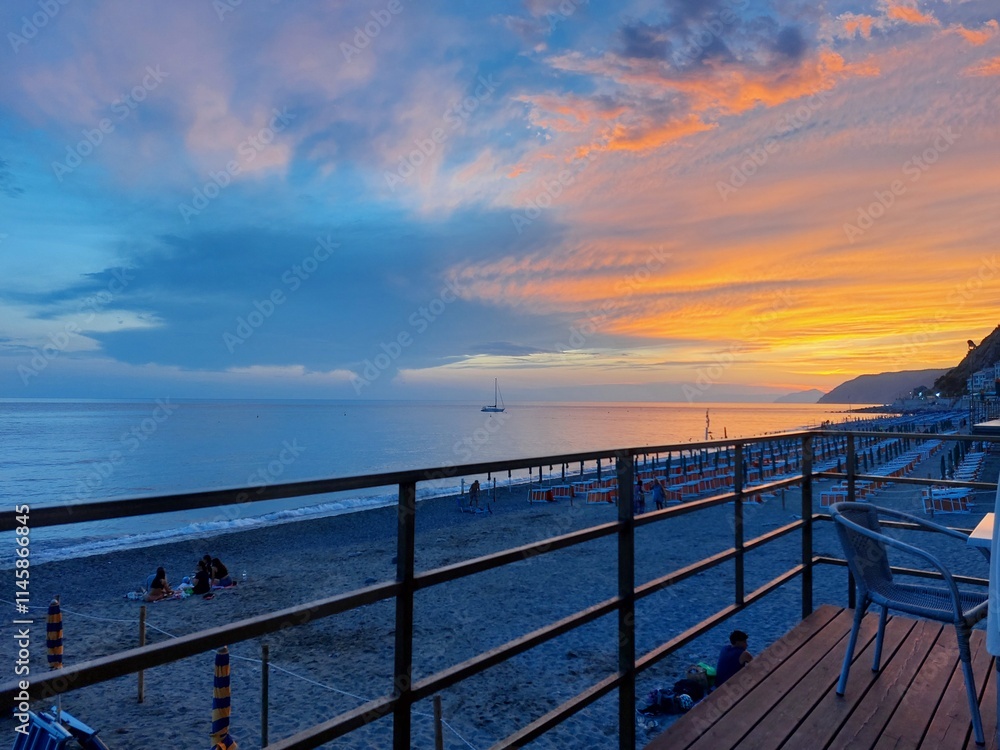 Fototapeta premium Sunset at Deiva Marina, Italy, at the pier